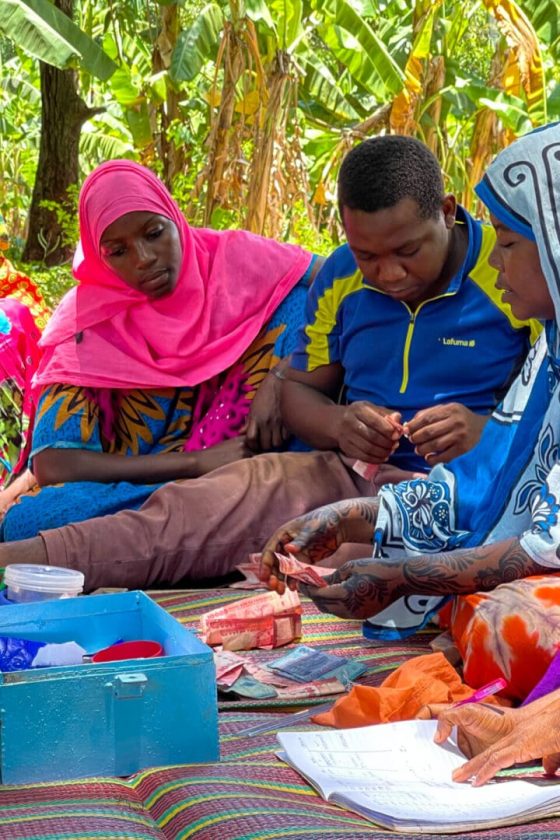 Members of the Mtende coastal community in Zanzibar gather to discuss local financial matters and community planning.