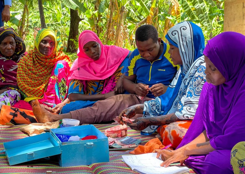 IMG_8253 Members of the Mtende coastal community in Zanzibar gather to discuss local financial matters and community planning.